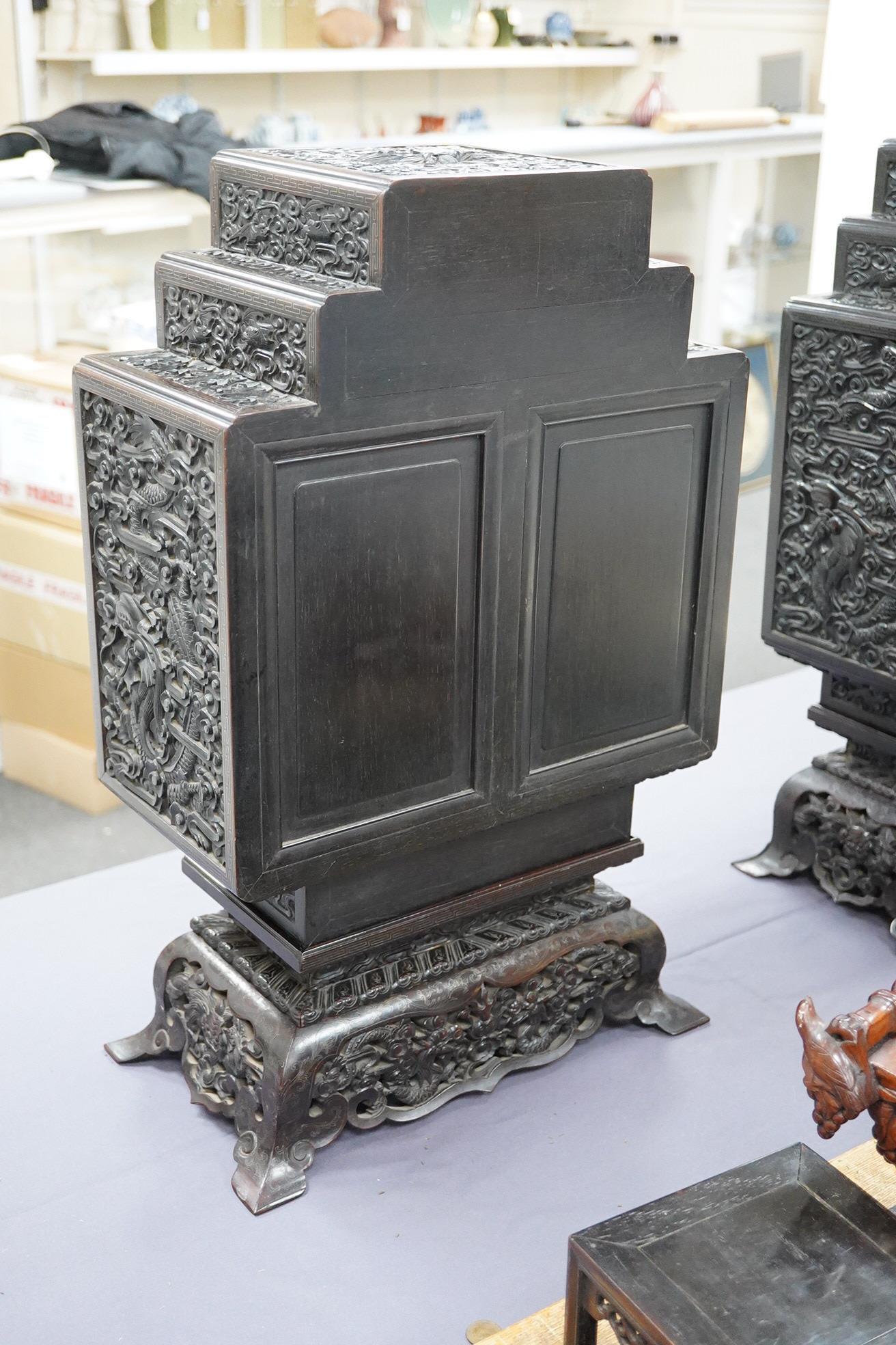 An important pair of Chinese carved zitan and silver wire inlaid ‘cloud and dragon’ curio cabinets and stands, duobaoge, probably Imperial, late Qing dynasty